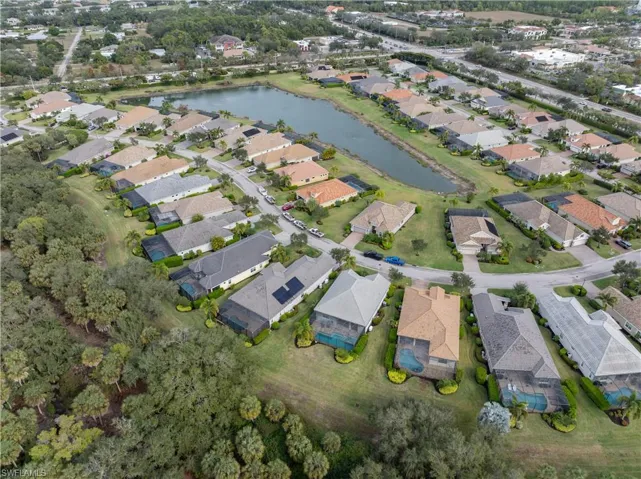View of property location with a large body of water and nearby suburban area