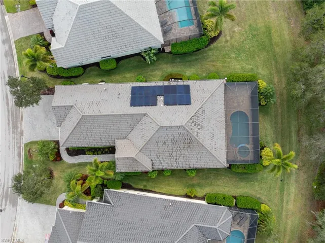 View of subject property featuring a pool