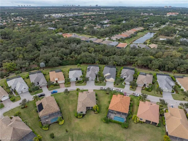 View of property location with nearby suburban area and a nearby body of water