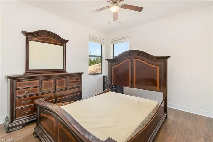 Bedroom with light wood-style flooring and ceiling fan