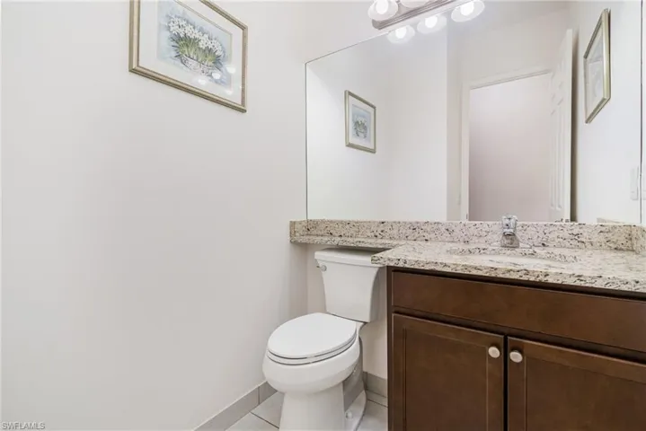 Bathroom with vanity and light tile patterned floors