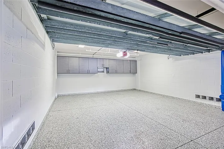 2-Car garage epoxy floor built-in cabinets