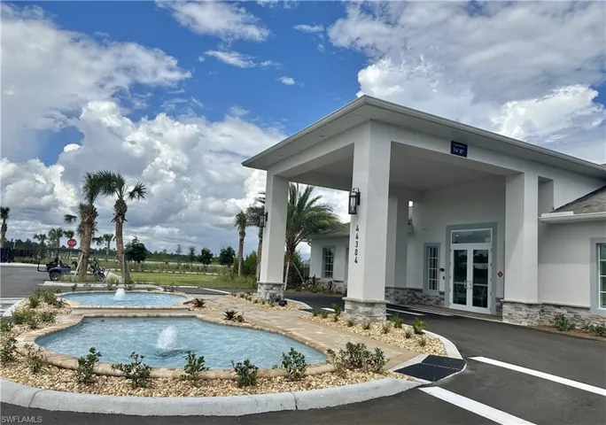 View of pool with french doors