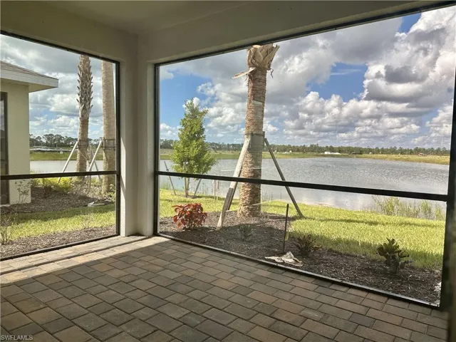 Unfurnished sunroom with a water view