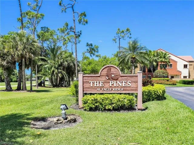 Community sign featuring a lawn