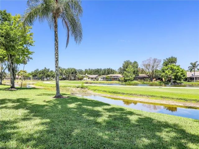 View of yard with a water view