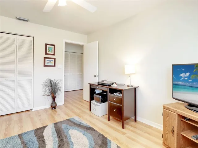 Office area featuring light hardwood / wood-style flooring and ceiling fan