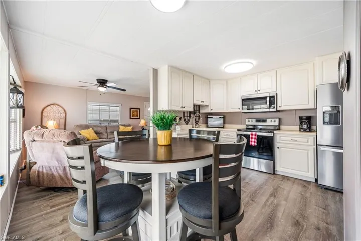 Dining space featuring light wood-style floors and ceiling fan