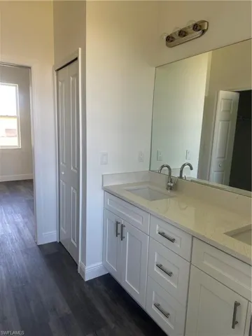 Bathroom featuring hardwood / wood-style floors and vanity