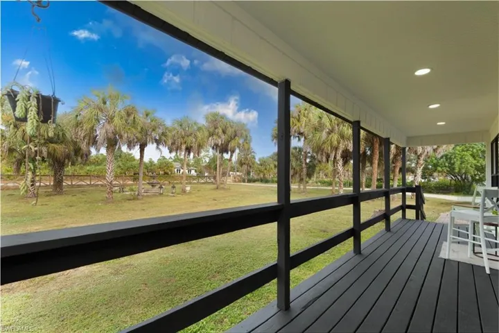 Porch featuring a lawn