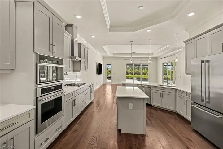 WALL OVENS.  GAS RANGE COOKTOP.  POT FILLER.  STAINLESS STEEL HOOD.