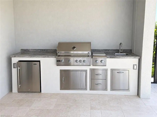 OUTDOOR LIVING AREA KITCHEN, SINK DOES NOT FUNCTION.
