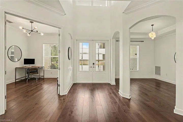 VIEW TOWARD FOYER/ENTRANCE.  DEN IS TO LEFT.  DINING AREA IS TO RIGHT.