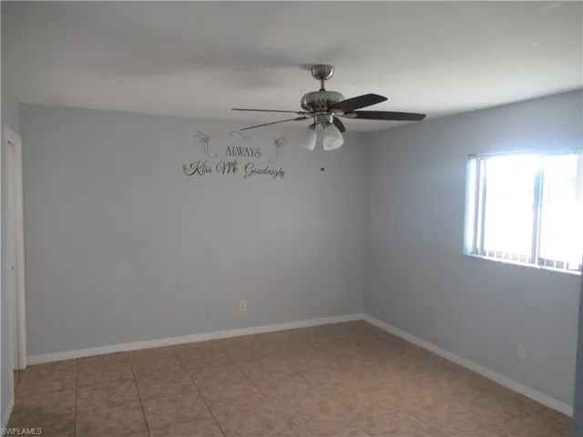 Empty room featuring ceiling fan