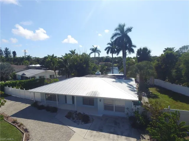 Aerial view of residential area with a large body of water