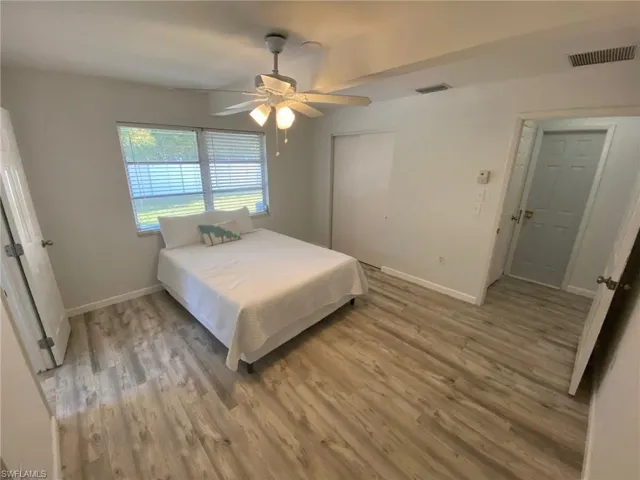 Bathroom featuring shower / tub combo, a textured ceiling, vanity, and tile patterned floors