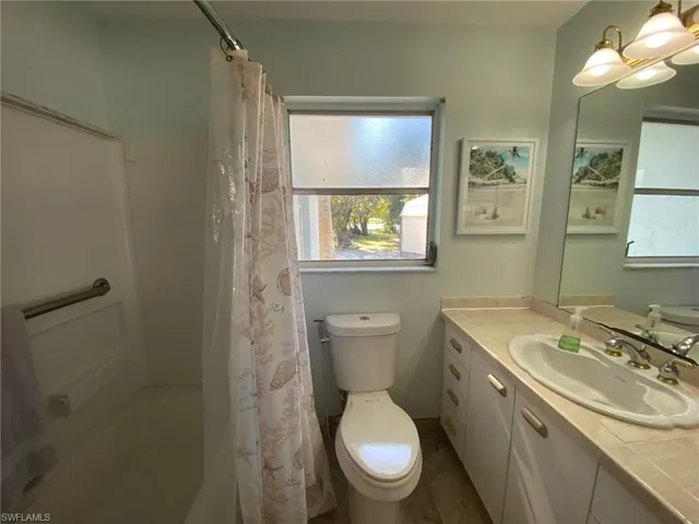 Unfurnished sunroom featuring a water view