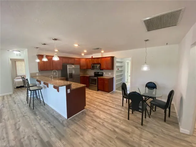 Bedroom featuring wood finished floors and ceiling fan