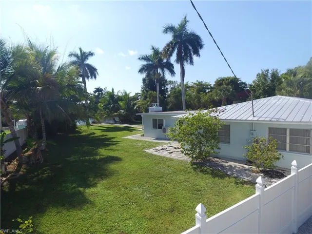 Back of property with a patio, french doors, and stucco siding