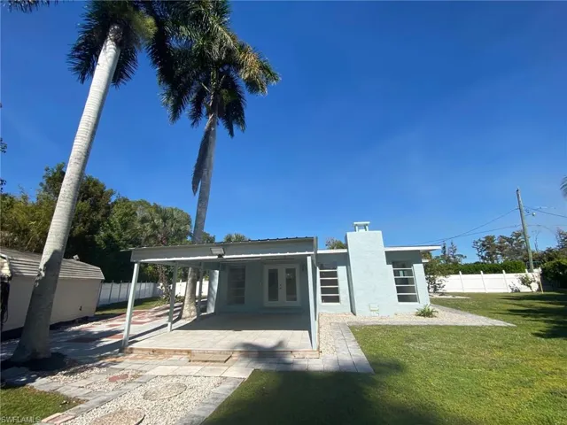 Unfurnished sunroom featuring a water view