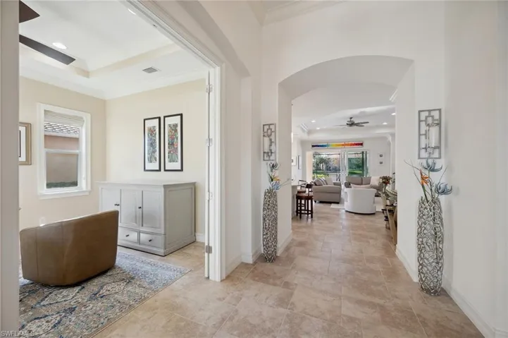 Hallway with french doors and ornamental molding
