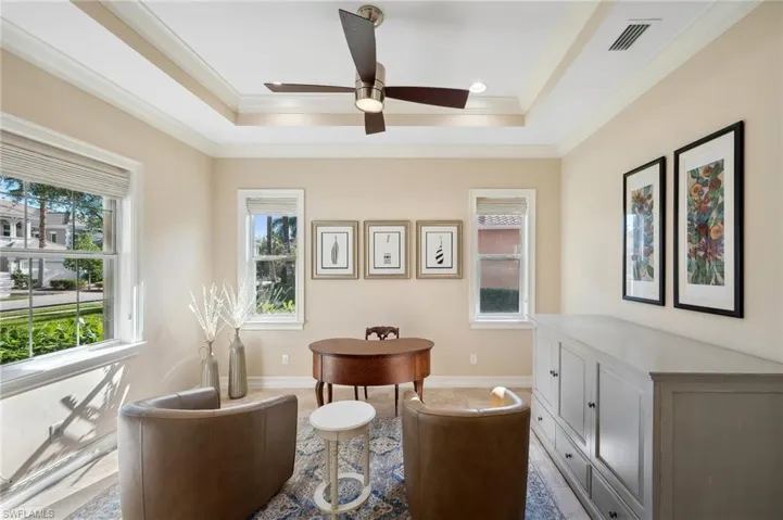 Living area featuring a wealth of natural light and a queen-sized Murphy chest for extra guests and family