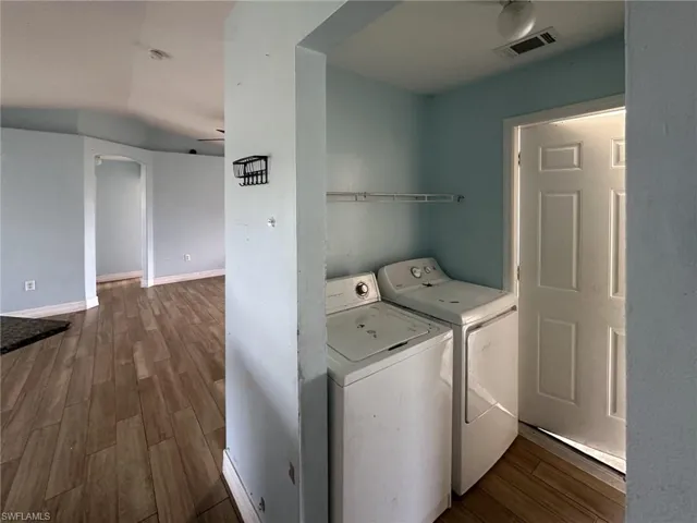 Dedicated laundry area with upper shelving