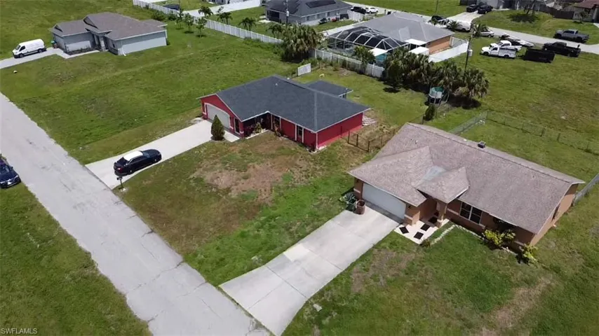 Single-story residence featuring a front-facing garage, concrete driveway, and a shingled roof