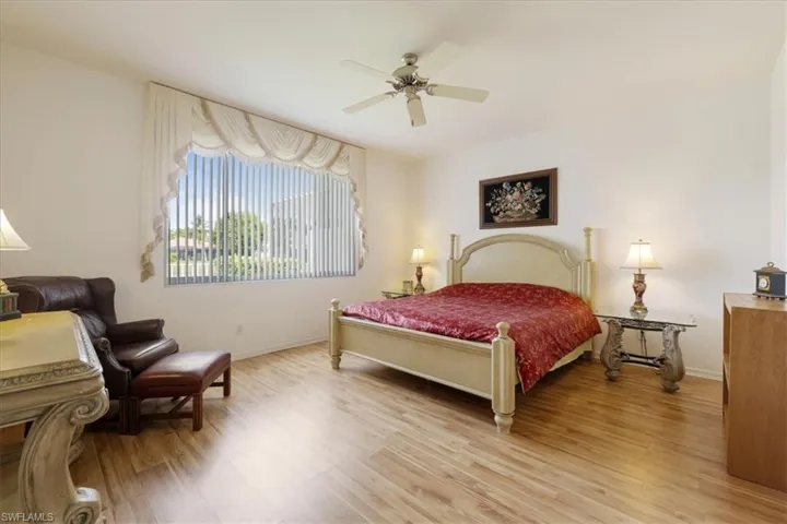 Bedroom featuring light wood-style flooring and a ceiling fan