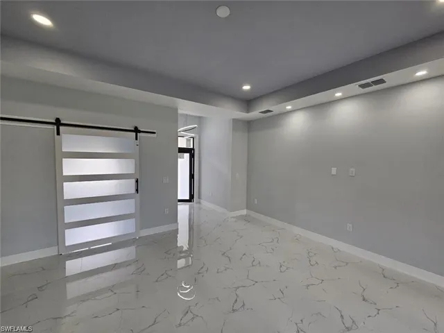 Basement featuring a barn door
