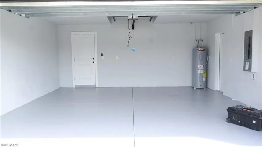 Garage featuring water heater