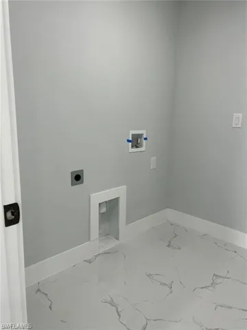 Laundry room featuring hookup for an electric dryer and hookup for a washing machine