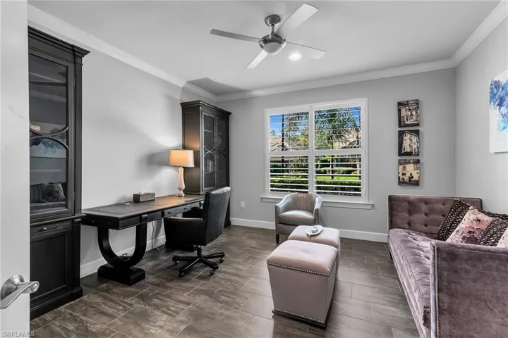 Office featuring ornamental molding and a ceiling fan