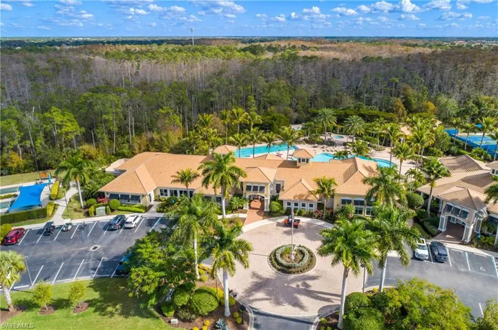 Bird's eye view of a pool area and a forest