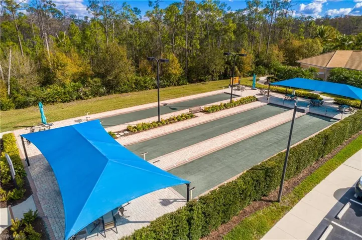 View of community with a yard and a game area