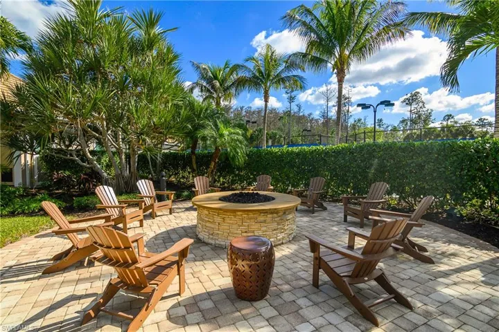 View of patio with a fire pit