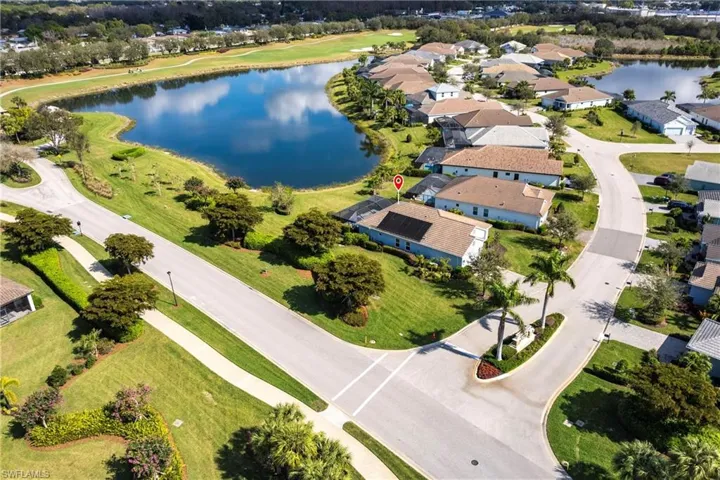 Aerial view featuring a water view and Golf Course in background
