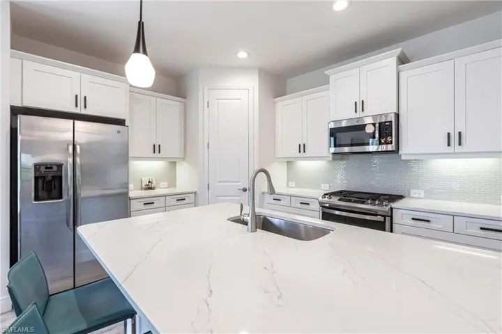 Kitchen is very spacious with plenty of cabinet space and pantry.