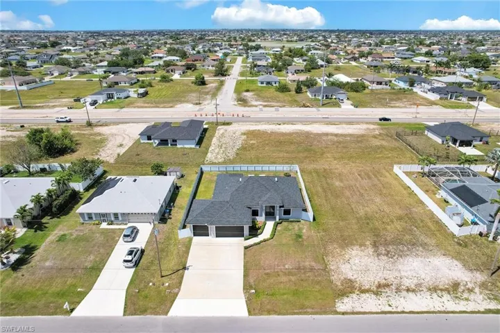 Birds eye view of property with a residential view