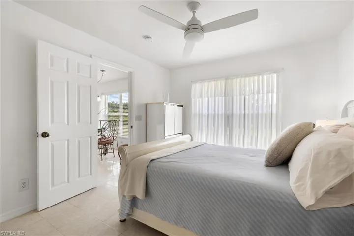 Tiled bedroom with ceiling fan