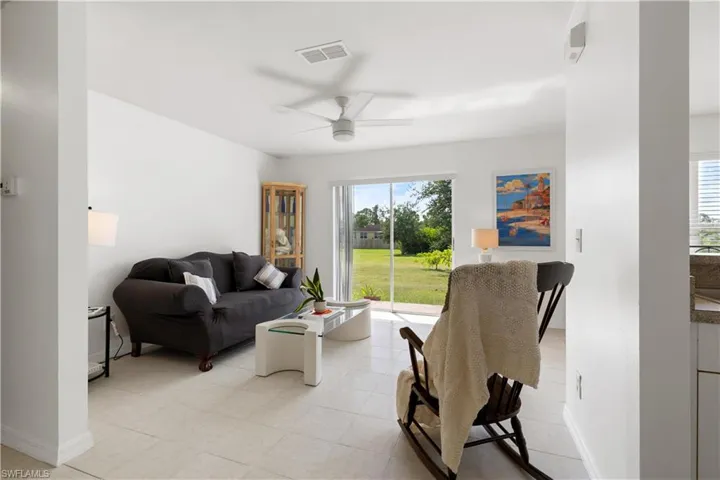 Living room featuring ceiling fan