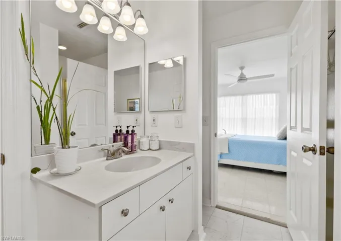 Bathroom featuring vanity and ceiling fan