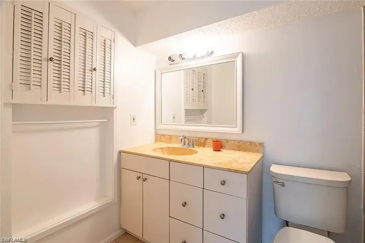 Bathroom with vanity and toilet