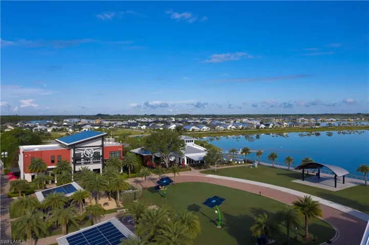 Birds eye view of property with a water view