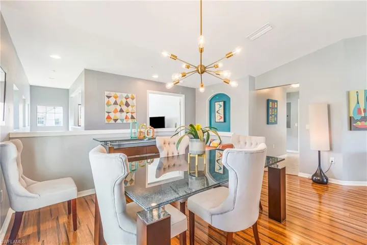 Dining space with a chandelier, laminate wood-like floors