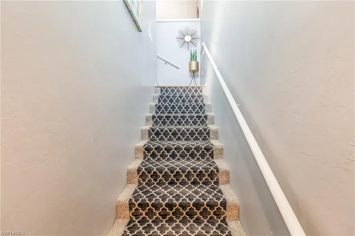 Carpeted interior stairs from garage