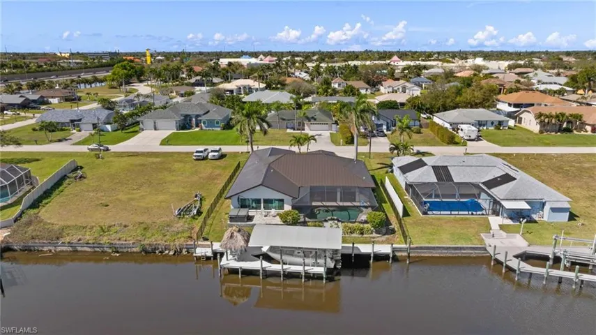 Bird's eye view with a water view and a residential view