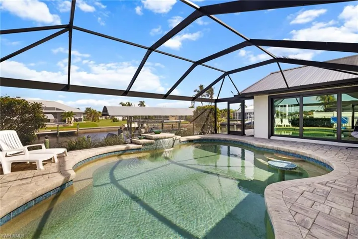 Outdoor pool featuring a patio area and a lanai