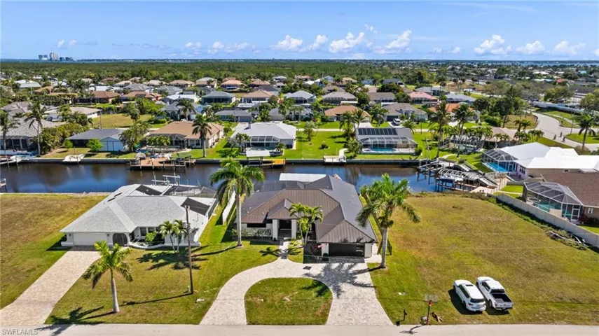 Aerial view featuring a water view and a residential view