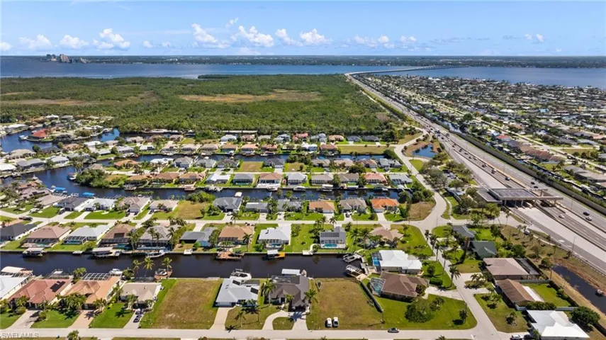 Bird's eye view with a water view and a residential view